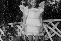 Doris Taylor in fancy dress costume probably in crepe paper, and made by Emily Taylor. Late 1930s