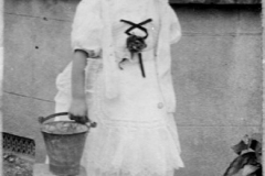 Alice Taylor dressed as a milkmaid for fancy dress competition in village fete. Approx. date 1912.