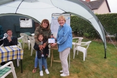 Anna receiving her prize from Claire Way (Haydon)